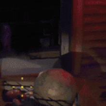 a globe is sitting on the floor in a dark room