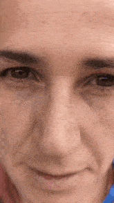 a close up of a man 's face with a smile on it .