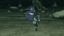 a person in a green shirt with a red heart on the back is fighting another person