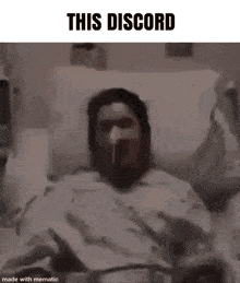 a man in a hospital bed with an oxygen mask on his face