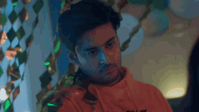 a man wearing a hoodie that says ' a ' on it