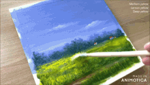 a painting of a field with the words made in animotica on the bottom right
