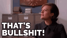 a woman is standing in front of a filing cabinet and says `` that 's bullshit ! ''