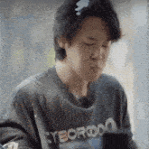 a close up of a person wearing a t-shirt that says cyborg on it