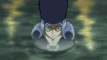 a woman in a blue hat is looking at a person in the water
