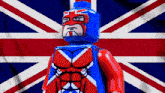a red white and blue lego figure with a british flag on his chest
