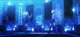 a group of anime girls standing on a stage with a city in the background