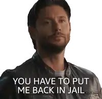 a man in a leather jacket has the words " you have to put me back in jail " below him
