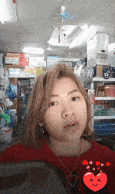 a woman in a red shirt with a heart and hearts around her face
