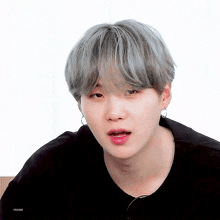 a close up of a person with gray hair