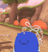 a blue cartoon character with a smiley face is standing on a dirt road