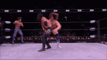 a wrestler in a ring with aew written on the walls