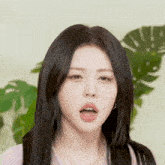 a close up of a woman making a face with her mouth open