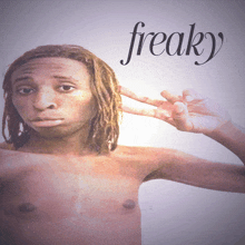 a shirtless man making a peace sign with the word freaky behind him