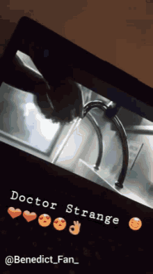 a laptop screen shows a doctor strange scene