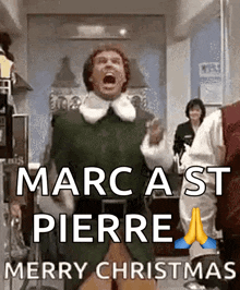 a man in a green elf costume is screaming and wishing merry christmas