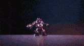 a robot is dancing in a dark room with a lot of lights behind it .