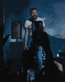a man wearing a t-shirt that says ' a ' on it