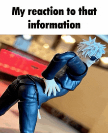 a picture of a figurine with the words my reaction to that information below it