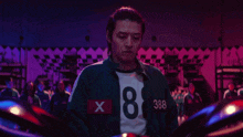 a man wearing a shirt with the number 8 on it