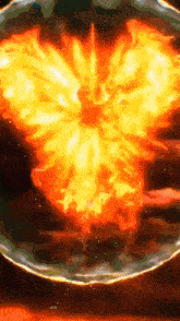 a painting of a large explosion with a circle of fire in the middle