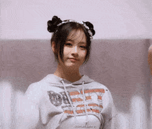 a girl wearing a hoodie that says dirty dog
