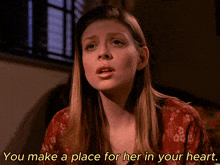 a woman in a red dress says you make a place for her in your heart