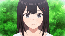 a close up of a girl 's face with a red ribbon in her hair