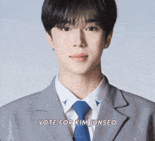 a man in a suit and tie with the words vote for kim junseo above him