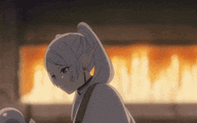 a girl with white hair is standing in front of a fireplace .