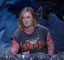 a woman is wearing a shirt that says ' hawaii ' on it