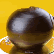 a cake that looks like a bomb with the words mr.cakes on the bottom