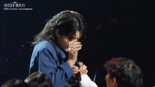 a woman singing into a microphone that says love is dangerous on the bottom