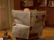 redforman reading newspaper what huh
