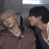 a man wearing a purple jacket with a button that says ' s ' on it