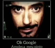 a close up of a man 's face with the text ok google amoleca meu pinto