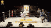 a woman in a white dress is in a wrestling ring with a man wearing a black shirt that says hawaii on it