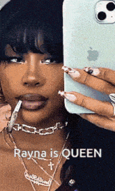 a woman is taking a selfie with a cigarette in her mouth and says rayna is queen