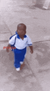 a little boy in a white shirt and blue pants is walking on a sidewalk with piyush written on the bottom right