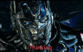 a picture of optimus prime from the movie transformers with the word thinking below him