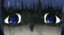 a close up of a person 's blue eyes
