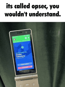 a flip phone with a screen that says its called opsec you wouldn t understand