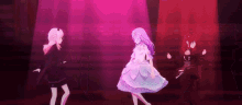 a group of anime girls are dancing on a stage in a dark room .