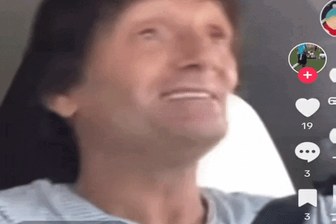 a close up of a man 's face in a car with the number 19 in the corner