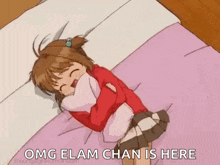 a girl is laying on a bed with a pillow in her lap and laughing .
