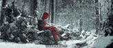 deadpool is sitting on a pile of logs in a snowy forest