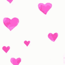 a bunch of pink hearts are on a white background