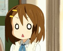 a girl with a surprised look on her face is wearing a blue bow tie
