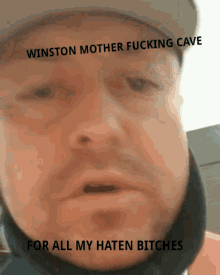 a man wearing a hat says winston mother fucking cave