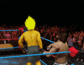 two wrestlers in a ring with one wearing a shirt that says ' wwe ' on it